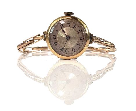 An early 20th century 18ct ladies manual wind bracelet wristwatch, the 20mm silvered dial with Arabic numerals, with 15 jewel