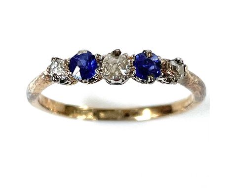 An 18ct gold diamond and sapphire five stone ring, the central diamond measuring 0.07ct, size L/M, weight 2g.One sapphire has