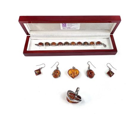 A collection of contemporary 925 amber set jewellery to include a bracelet, heart shaped pendant, a ring and two pairs of ear