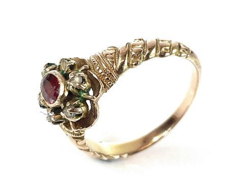 A Victorian gold, diamond and ruby set cluster ring, the milgrain set oval ruby measuring 0.08ct, surrounded by six small cla