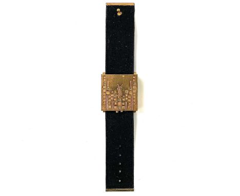 An Yves Saint Laurent gilt metal bracelet compact.