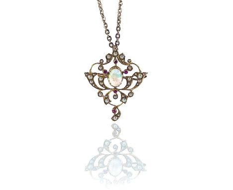 An Edwardian Art Nouveau 18ct opal, pearl and ruby set open work pendant necklace, of foliate scroll design the oval white op