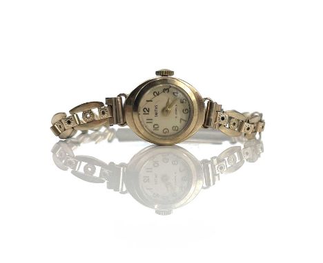 A Smiths 9ct ladies manual wind wristwatch with 15 jewel movement, the case hallmarked London 1962, on a gold plated bracelet