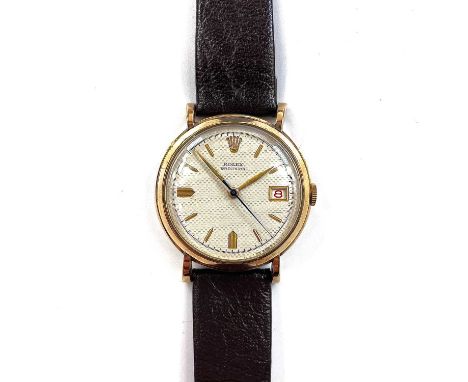 A 1950's 9ct Rolex Precision date manual wind wristwatch, the 28mm signed cream honeycomb dial with gilt baton markers and a 