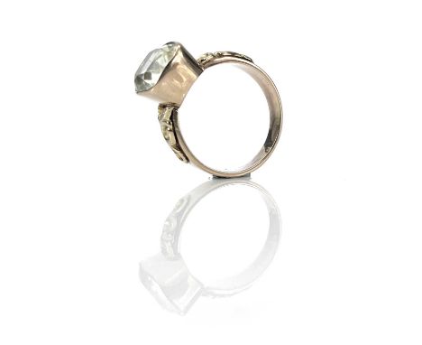 A Victorian gold Chrysberyl set ring, the cushion cut stone in a collet setting measuring 5.2ct approximately, the shoulders 