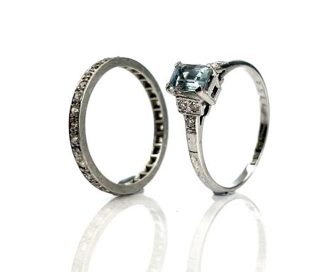 An 18ct white gold and platinum aquamarine and diamond set ring, the aquamarine measuring 0.20ct approximately, the shoulders