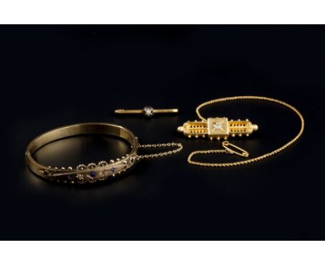 A VICTORIAN DIAMOND SET PANEL BROOCH, of pierced design with beaded border and central old-cut diamond, stamped '12ct', suspe