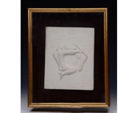 A 20TH CENTURY WHITE CERAMIC TILE depicting naked figures embracing, 23 x 20cm within a gilt three dimensional glazed frame
