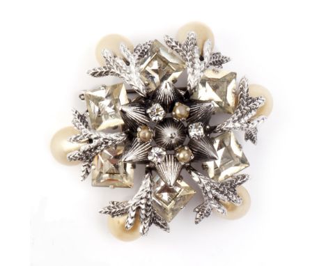 A COLLECTION OF COSTUME JEWELLERY BY CHRISTIAN DIOR, comprising a 1960s paste and simulated pearl snowflake brooch, with make