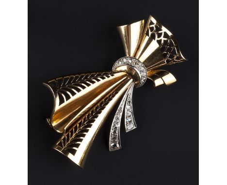 A DIAMOND SET BROOCH, circa 1945, modelled as a stylised bow, with rose-cut diamond set ribbon and pierced decoration, the re