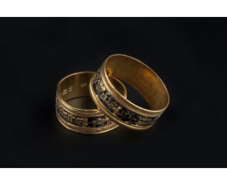 THREE 19TH CENTURY GOLD AND ENAMEL MEMORIAL RINGS, the first with central black enamel band and gilt inscription 'In memory o