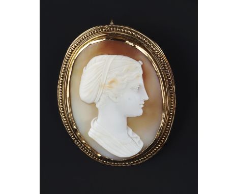 A VICTORIAN CAMEO BROOCH/PENDANT, the oval shell cameo carved to depict a classical female portrait profile, to bead and rope