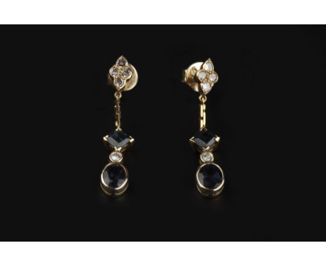 A PAIR OF SAPPHIRE AND DIAMOND SET EAR PENDANTS, each suspending a square and oval-cut sapphire drop, spaced by brilliant-cut