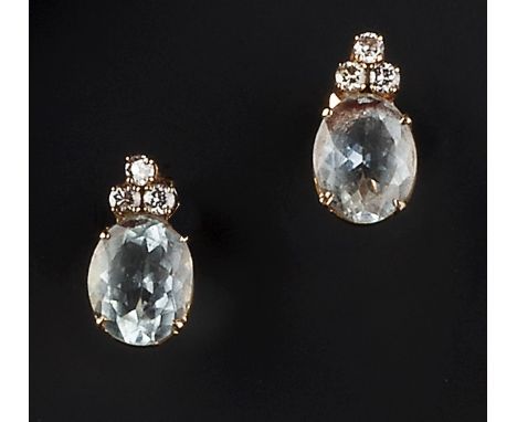 A PAIR OF AQUAMARINE AND DIAMOND EARSTUDS, each oval mixed-cut aquamarine surmounted by a trio of brilliant-cut diamonds, on 