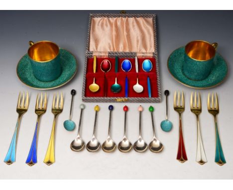 A SET OF SIX SILVER GILT AND ENAMEL COFFEE SPOONS of individual colours by David Andersen, cased; a set of tea forks by the s