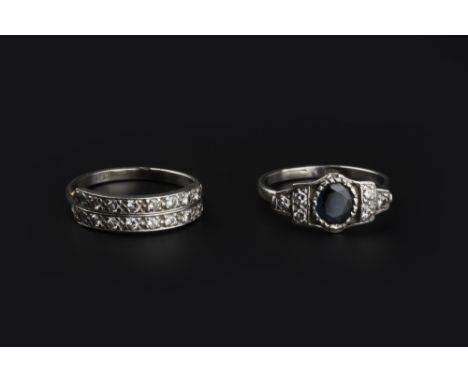 TWO DIAMOND SET RINGS, the first designed as a double row half hoop ring, set with brilliant-cut diamonds, the second a panel