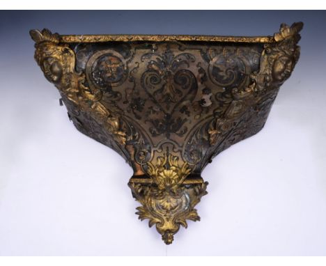 AN 18TH CENTURY FRENCH 'BOULLE' CLOCK BRACKET with brass inlaid decoration and rococo mounts, 42cm wide