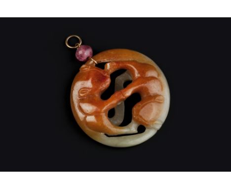 A CARVED CIRCULAR JADE PENDANT, with pink paste bead surmount, (jade untested for treatments), panel diameter 5.3cm 