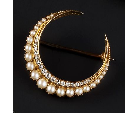 A VICTORIAN HALF PEARL AND DIAMOND CRESCENT BROOCH, highlighted with rows of graduated half pearls and old-cut diamonds, gold