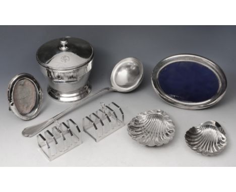 A PAIR OF FOUR DIVISIONAL SILVER TOAST RACKS, 7.5cm wide, Sheffield 1934 by Viner's Ltd; a silver scallop shaped butter dish 