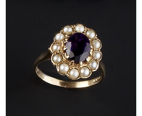 AN AMETHYST AND HALF PEARL CLUSTER RING, the oval mixed-cut amethyst claw set within a border of half pearls, 9ct gold mounte