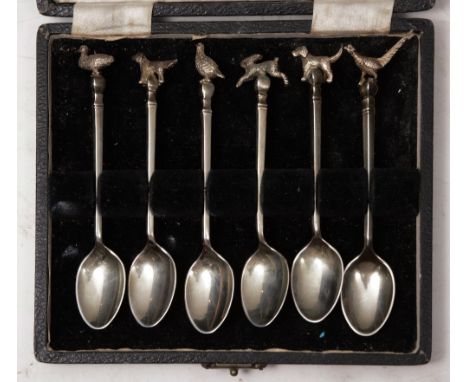 A SET OF SIX SILVER COFFEE SPOONS with game and hunting finials, 11cm long, Birmingham 1948 by William Suckling Ltd, cased, 2