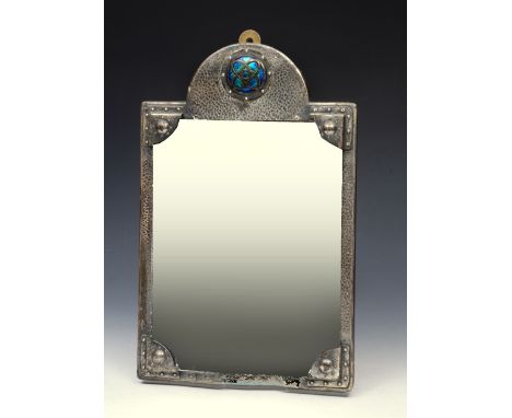 AN ARTS & CRAFTS BEATEN PEWTER HALL MIRROR with stylised decoration and blue enamel plaque, 38 x 24cm
