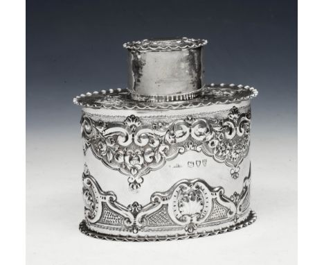A VICTORIAN SILVER TEA CADDY, oval shaped with chased foliate and scroll decoration and with a press on lid, 10cm high, Londo
