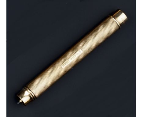 A 9CT GOLD PROPELLING PENCIL, by Sampson Mordan & Co, of cylindrical engine-turned form, hallmarked for London 1937, initiall
