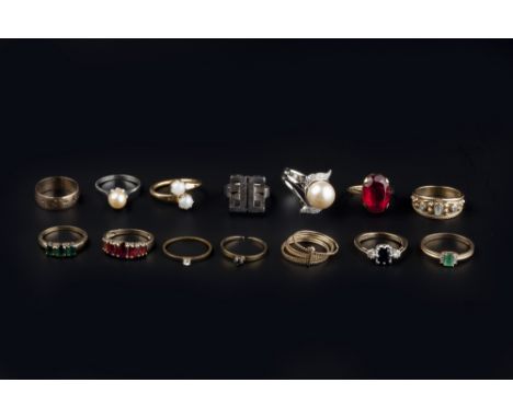 A COLLECTION OF DRESS RINGS, to include a sapphire and diamond three stone ring, mounted in 9ct gold, an emerald and diamond 