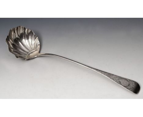A GEORGE III IRISH SILVER SOUP LADLE with scallop shell shaped bowl and with a chased and engraved Old English style handle d