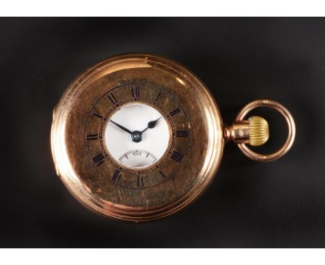 A 9CT GOLD HALF HUNTER POCKET WATCH, the white enamel dial with Roman numerals and subsidiary seconds dial, to keyless wind m