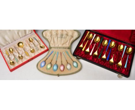 A SET OF SILVER, GILT AND ENAMEL TEA FORKS AND SPOONS, each pair in a different colour by Egon Lauridsen (Copenhagen 1936-196