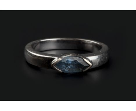 A GEM SET DRESS RING, the navette-shaped blue stone in an 18ct white gold mount, ring size approximately K