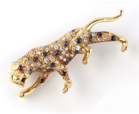 A DIAMOND AND GEM SET PANTHER BROOCH, the body pavè set with brilliant-cut diamonds and circular-cut sapphires, the head with