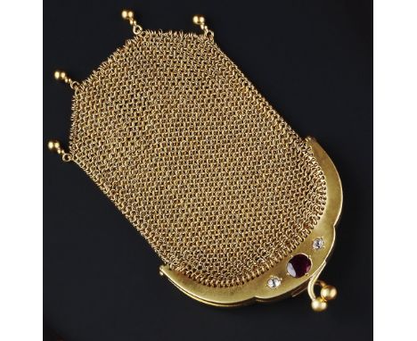 A RUBY AND DIAMOND SET MESH-LINK PURSE, with beaded fringe, the hinged frame inset with an oval mixed-cut ruby between two cu