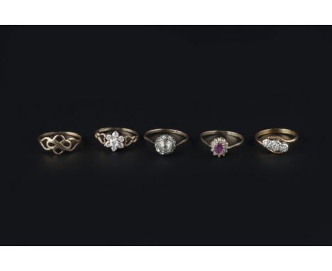 A COLLECTION OF DRESS RINGS, comprising a diamond three stone crossover ring, illusion set with brilliant and single-cut diam