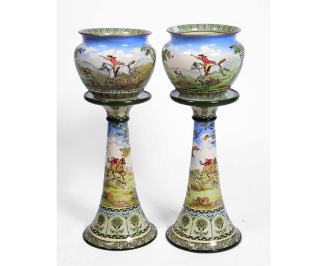 A PAIR OF ROYAL DOULTON SERIES WARE JARDINIERES AND STANDS decorated with continuous hunting scenes, D1698, 76.5cm high overa