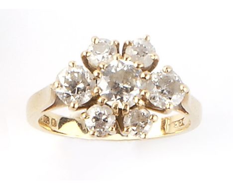 A DIAMOND CLUSTER RING, claw set with graduated brilliant and old-cut diamonds, 18ct gold mounted, total diamond weight appro