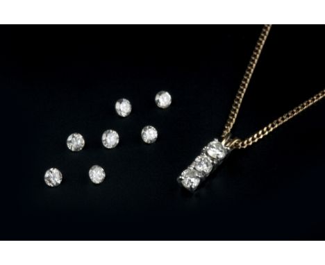A DIAMOND PENDANT, claw set with a trio of round brilliant-cut diamonds, 18ct gold mounted, suspended from a 9ct gold fine cu