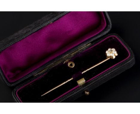 A VICTORIAN DIAMOND AND HALF PEARL STICK PIN, the cluster terminal with central old-cut diamond framed by half pearls, detach