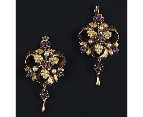 A PAIR OF RUBY AND HALF PEARL SET EAR PENDANTS, of openwork foliate design, with engraved decoration, on later post fittings,
