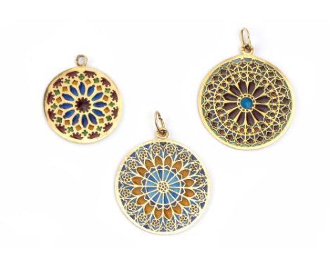 A COLLECTION OF FRENCH PLIQUE-À-JOUR ENAMEL PENDANTS, each circular panel modelled as a stained glass window from Notre Dame 
