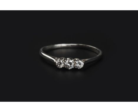 A DIAMOND THREE STONE RING, claw set with round brilliant-cut diamonds, white precious metal mounted, ring size S 