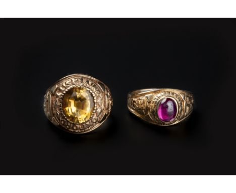 TWO GEM SET OXFORD UNIVERSITY RINGS, the first set with an oval mixed-cut citrine, the second set with an oval cabochon synth
