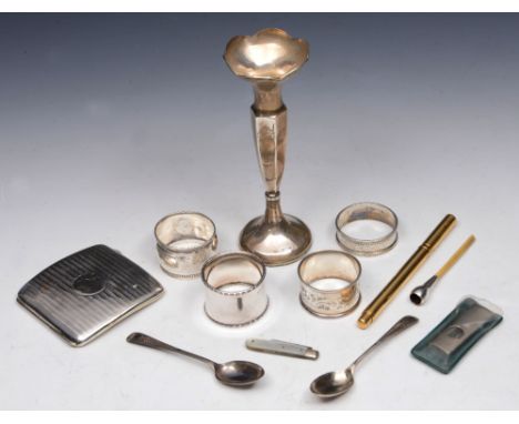 A COLLECTION OF SILVER TO INCLUDE: three varying napkin rings, a silver cigarette case, two bright cut teaspoons, a silver an