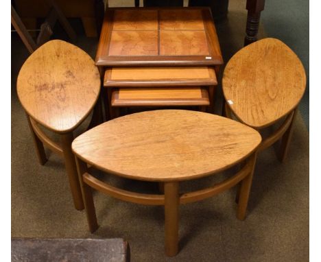 Nest of three teak tiled top coffee tables, together with three teak lamp tables   Condition: 
