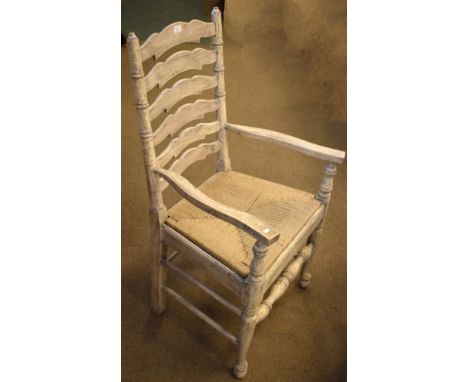 Distressed grey painted finish ladder back open arm elbow chair, standing on pad supports united by stretchers   Condition: 