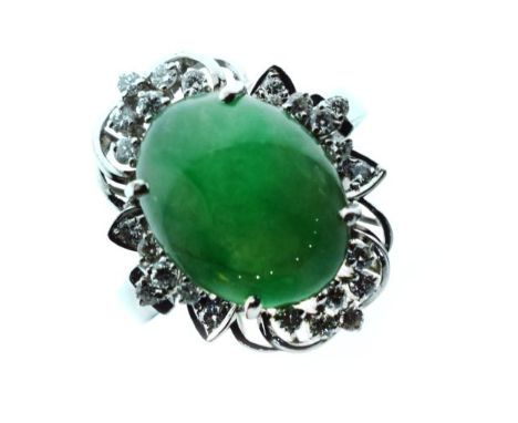 18ct gold ring set central oval jade cabochon within a diamond surround, size O   Condition: 