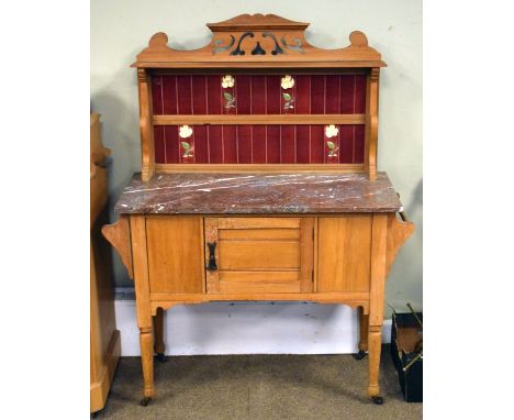 Edwardian stripped satin walnut washstand, the raised back fitted pierced pediment, open shelf and Art Nouveau design stylise